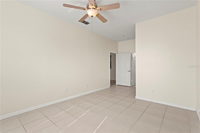 unfurnished room featuring visible vents, baseboards, ceiling fan, and light tile patterned floors