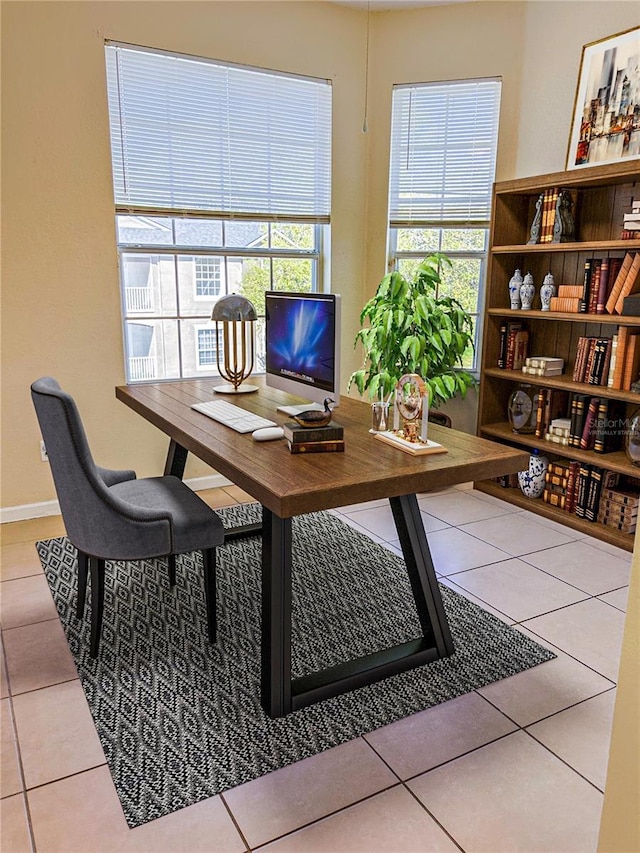 home office featuring tile patterned floors and baseboards