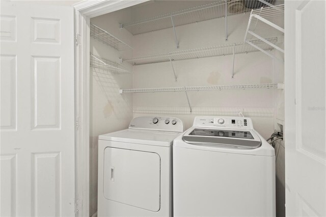 laundry room featuring washing machine and dryer