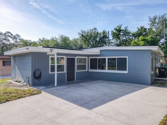 4514 Southmore Dr, Orlando, FL 32812 - view of front of property featuring concrete block siding and a patio area