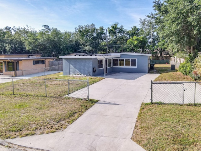 4514 Southmore Dr, Orlando, FL 32812 - view of front of home featuring a front lawn and concrete driveway