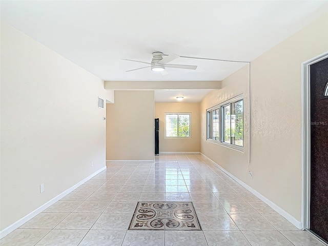 4514 Southmore Dr, Orlando, FL 32812 - empty room with baseboards, visible vents, light tile patterned floors, and ceiling fan