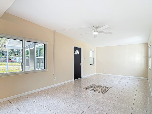 4514 Southmore Dr, Orlando, FL 32812 - entrance foyer featuring light tile patterned floors, a healthy amount of sunlight, ceiling fan, and baseboards