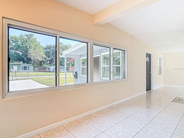4514 Southmore Dr, Orlando, FL 32812 - unfurnished room featuring baseboards, light tile patterned floors, and beam ceiling