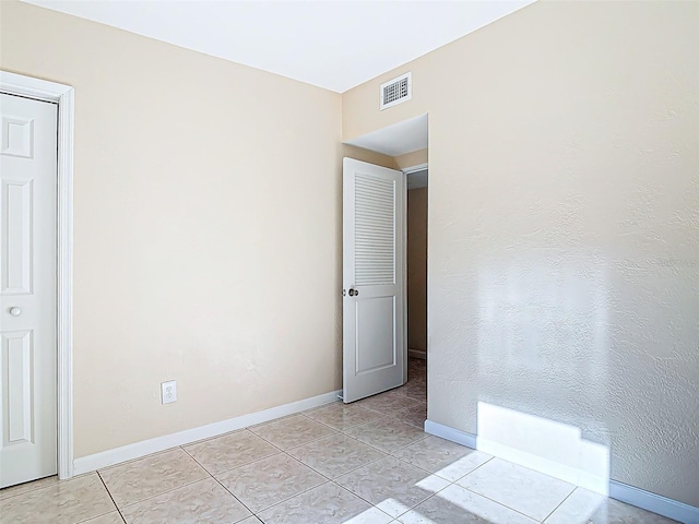 4514 Southmore Dr, Orlando, FL 32812 - empty room featuring baseboards, visible vents, and light tile patterned flooring