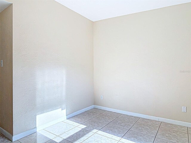 4514 Southmore Dr, Orlando, FL 32812 - unfurnished room with light tile patterned flooring and baseboards