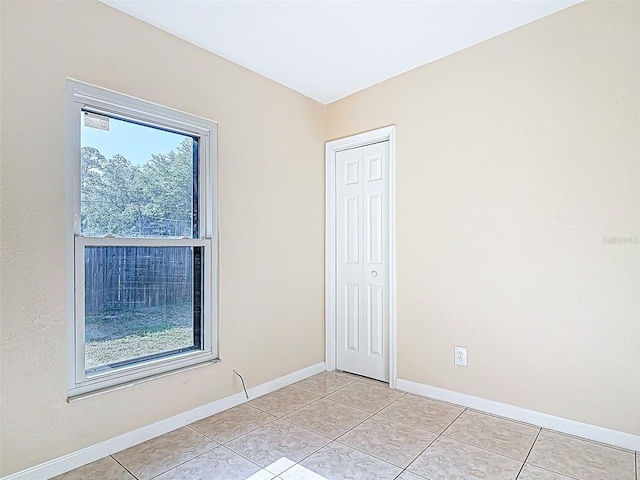 4514 Southmore Dr, Orlando, FL 32812 - unfurnished room with light tile patterned flooring and baseboards
