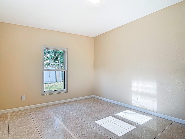 4514 Southmore Dr, Orlando, FL 32812 - unfurnished room with light tile patterned flooring and baseboards