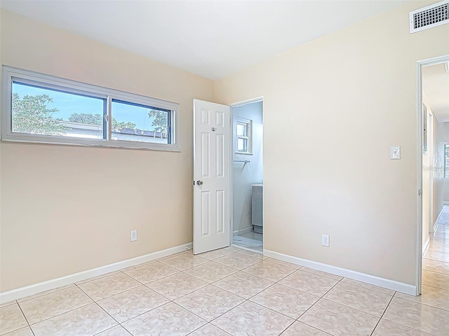 4514 Southmore Dr, Orlando, FL 32812 - unfurnished bedroom featuring light tile patterned floors, visible vents, and baseboards