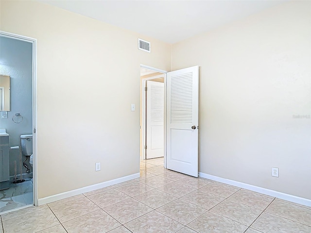 4514 Southmore Dr, Orlando, FL 32812 - unfurnished bedroom featuring light tile patterned floors, visible vents, and baseboards