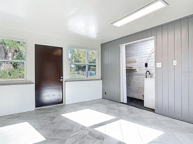 4514 Southmore Dr, Orlando, FL 32812 - interior space with light tile patterned flooring and wooden walls