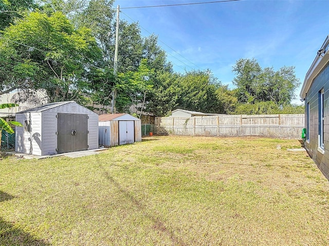 4514 Southmore Dr, Orlando, FL 32812 - view of yard with a fenced backyard, an outbuilding, and a storage shed
