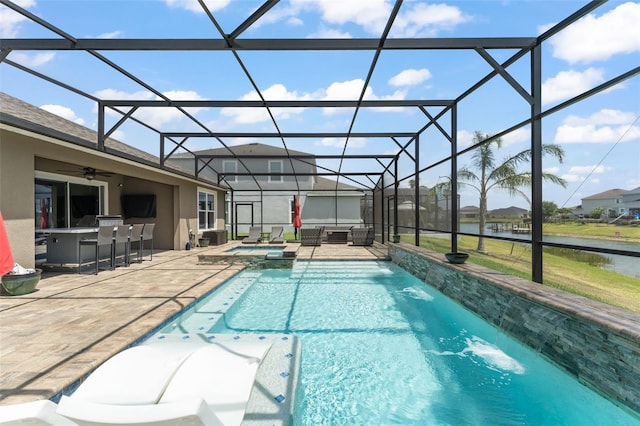 view of swimming pool with a patio area, a lanai, outdoor dry bar, and a pool with connected hot tub