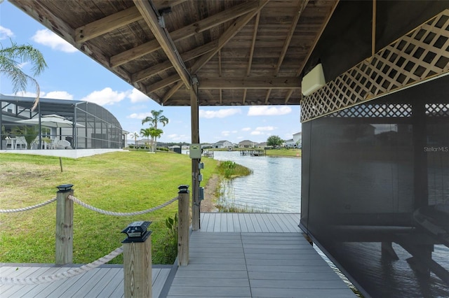 view of dock featuring a residential view, a water view, and a yard