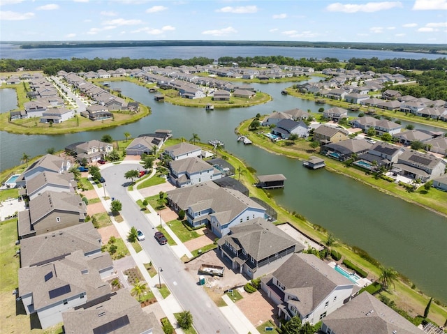 birds eye view of property featuring a residential view and a water view