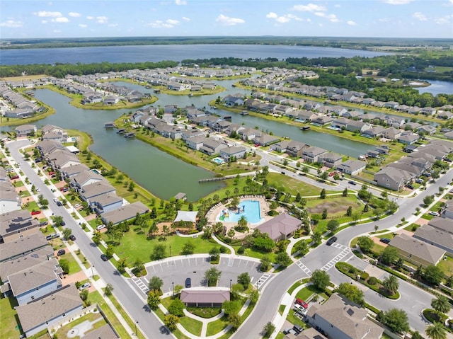 aerial view with a residential view and a water view