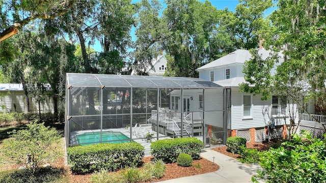 404 N Clara Ave, Deland, FL 32720 - view of front of home with an outdoor pool, a lanai, and a patio area