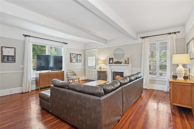 404 N Clara Ave, Deland, FL 32720 - living area featuring a warm lit fireplace, wood-type flooring, and beam ceiling