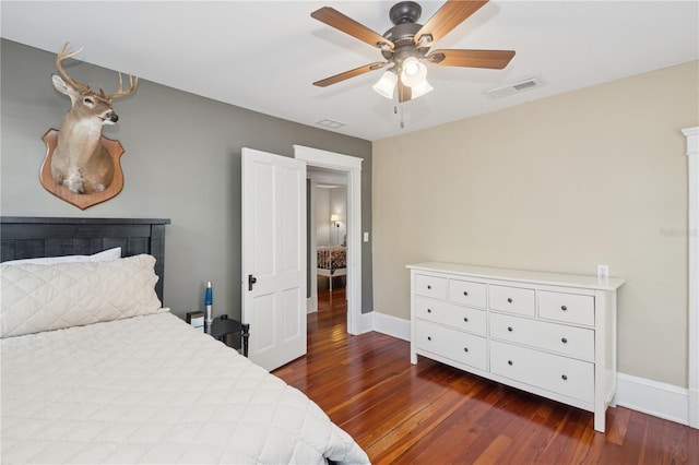 404 N Clara Ave, Deland, FL 32720 - bedroom with dark wood-style floors and a ceiling fan
