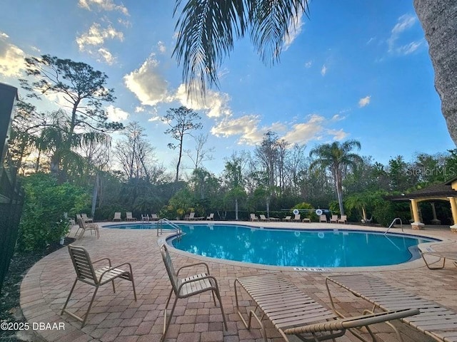141 Campanello Ct, Daytona Beach, FL 32117 - community pool featuring a patio area and view of scattered trees