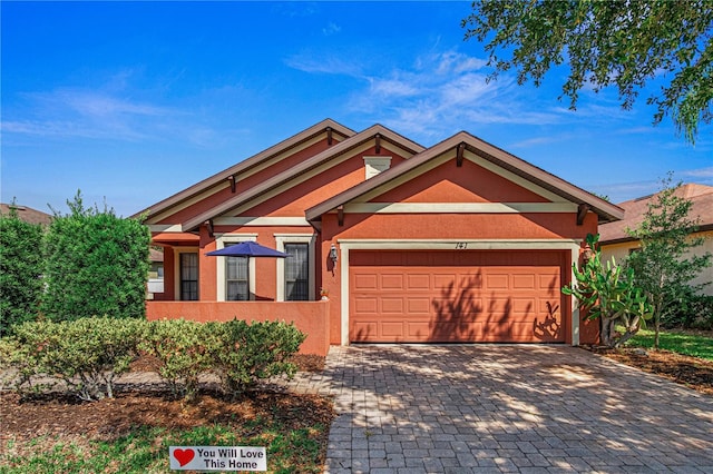 141 Campanello Ct, Daytona Beach, FL 32117 - view of front of home featuring a garage, decorative driveway, and stucco siding