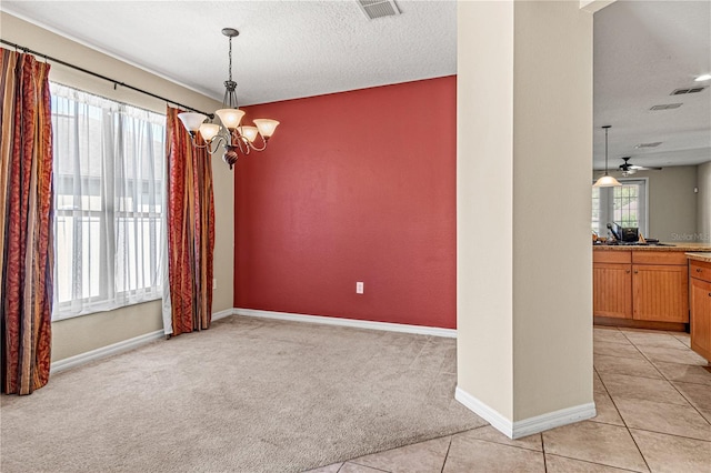 141 Campanello Ct, Daytona Beach, FL 32117 - unfurnished dining area with light carpet, a chandelier, baseboards, light tile patterned flooring, and a ceiling fan