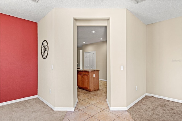 141 Campanello Ct, Daytona Beach, FL 32117 - spare room featuring a textured ceiling, light tile patterned flooring, and baseboards