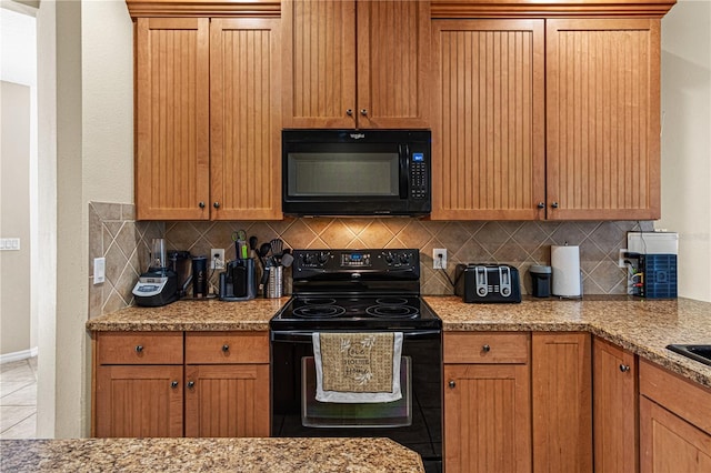 141 Campanello Ct, Daytona Beach, FL 32117 - kitchen with black appliances, tasteful backsplash, and baseboards