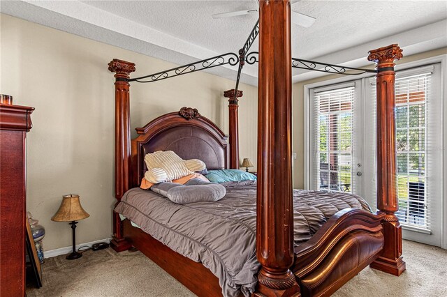 141 Campanello Ct, Daytona Beach, FL 32117 - carpeted bedroom featuring access to outside, a textured ceiling, baseboards, and a ceiling fan
