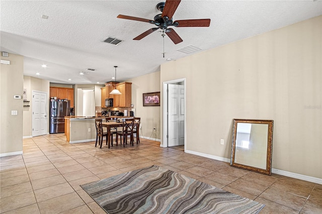 141 Campanello Ct, Daytona Beach, FL 32117 - living area with a textured ceiling, light tile patterned floors, ceiling fan, baseboards, and recessed lighting