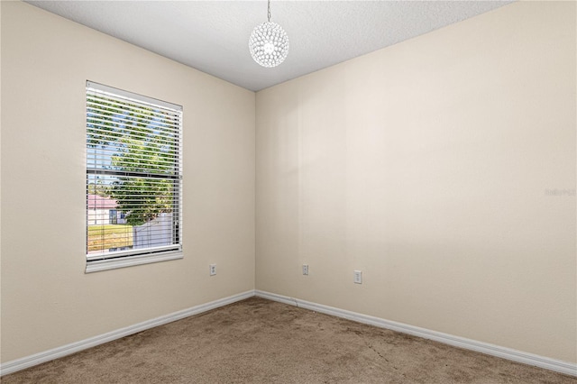 141 Campanello Ct, Daytona Beach, FL 32117 - carpeted spare room with a chandelier and baseboards