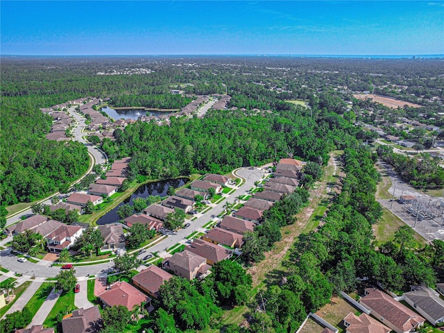 141 Campanello Ct, Daytona Beach, FL 32117 - aerial view of property's location featuring nearby suburban area, a large body of water, and a heavily wooded area