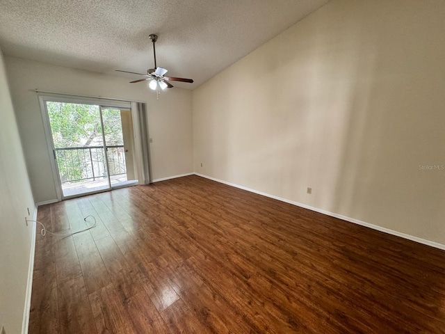 unfurnished room with baseboards, dark wood-style floors, a textured ceiling, and ceiling fan