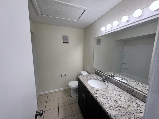 bathroom featuring vanity, baseboards, toilet, tile patterned flooring, and visible vents
