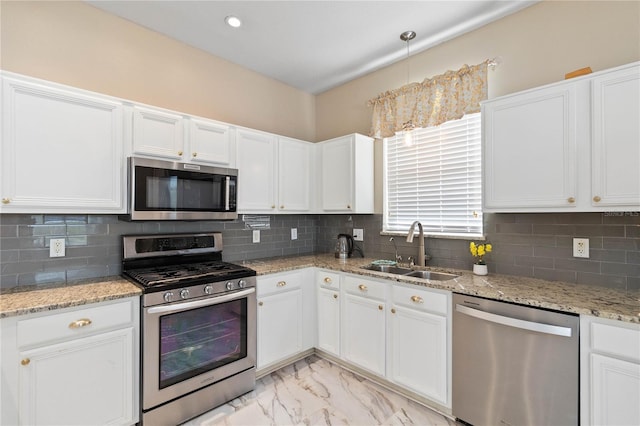 kitchen featuring a sink, white cabinetry, and stainless steel appliances