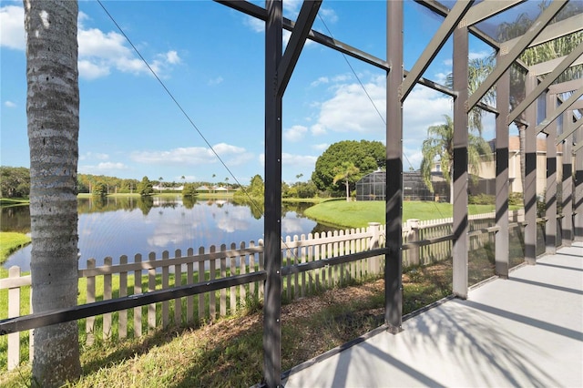 exterior space featuring a water view and fence private yard