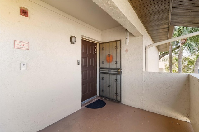 6102 Curry Ford Rd Unit 202, Orlando, FL 32822 - doorway to property featuring stucco siding