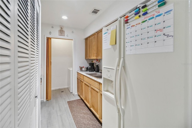 6102 Curry Ford Rd Unit 202, Orlando, FL 32822 - bar featuring recessed lighting, visible vents, white refrigerator with ice dispenser, and a sink