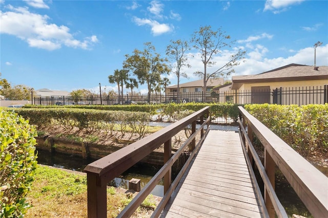 6102 Curry Ford Rd Unit 202, Orlando, FL 32822 - dock area featuring fence and a water view