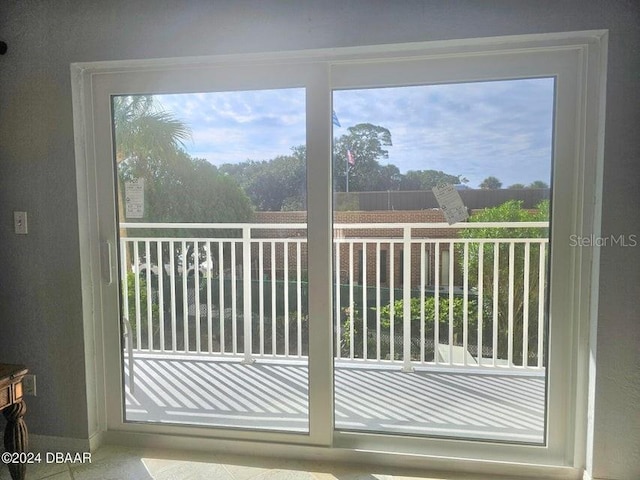 145 N Halifax Ave Unit 205, Daytona Beach, FL 32118 - doorway with a wealth of natural light