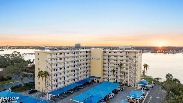 145 N Halifax Ave Unit 205, Daytona Beach, FL 32118 - property at dusk featuring a water view