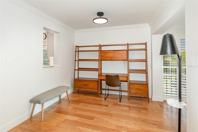 office space featuring baseboards, ornamental molding, and wood finished floors
