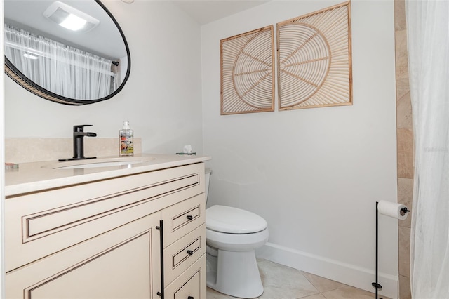 bathroom with curtained shower, tile patterned flooring, vanity, and toilet