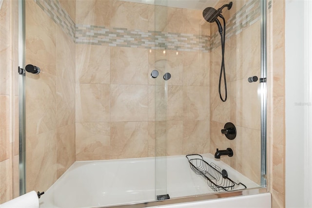 full bath featuring combined bath / shower with glass door