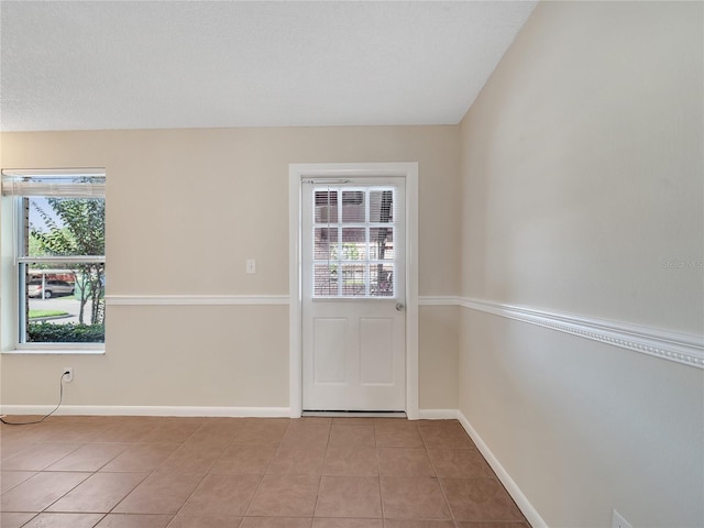 200 Saint Andrews Blvd Unit 2306, Winter Park, FL 32792 - doorway to outside featuring healthy amount of natural light and light tile patterned floors
