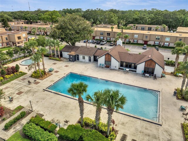 200 Saint Andrews Blvd Unit 2306, Winter Park, FL 32792 - community pool featuring a patio area and a residential view