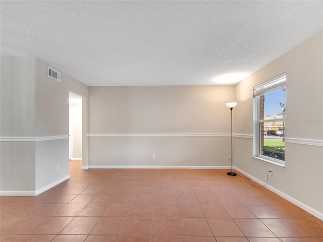 200 Saint Andrews Blvd Unit 2306, Winter Park, FL 32792 - tiled empty room featuring a textured ceiling and baseboards