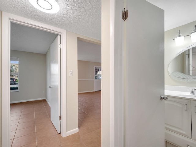200 Saint Andrews Blvd Unit 2306, Winter Park, FL 32792 - hall featuring light tile patterned floors and a textured ceiling