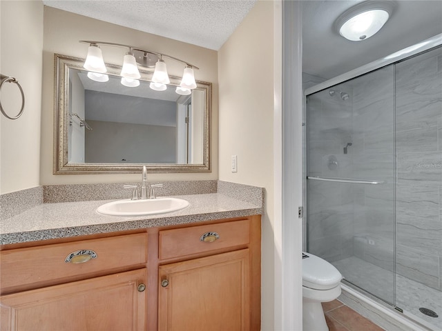 200 Saint Andrews Blvd Unit 2306, Winter Park, FL 32792 - bathroom featuring a shower stall, vanity, tile patterned flooring, and a textured ceiling