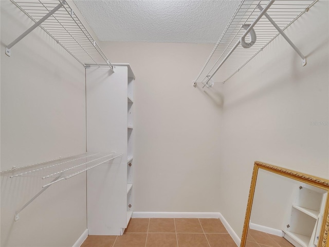 200 Saint Andrews Blvd Unit 2306, Winter Park, FL 32792 - spacious closet featuring light tile patterned flooring